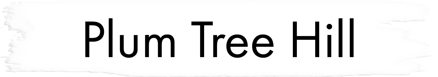 A white banner with black text reading "Plum Tree Hill".