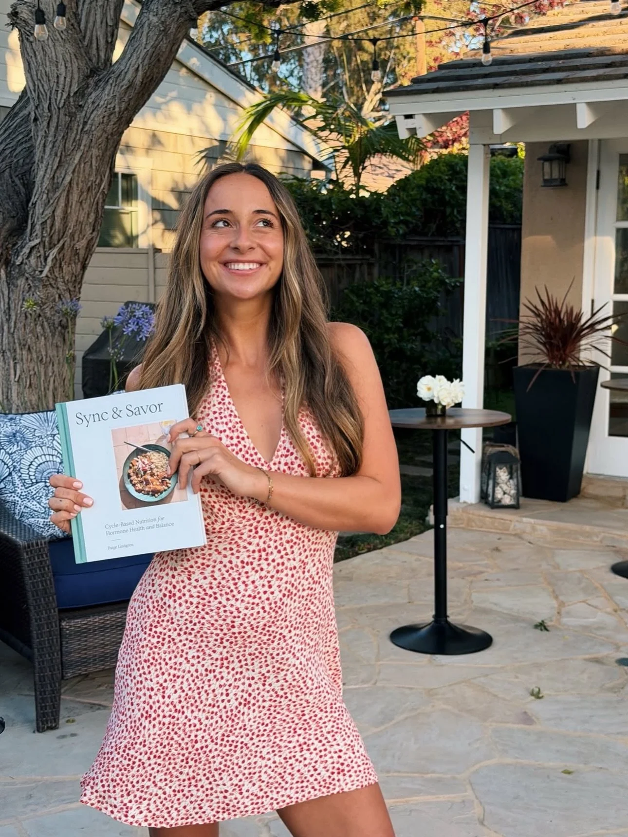 With the release of her debut cookbook Sync &amp; Savor, @paige.lindgren brought her wellness community together through a series of launch moments in Los Angeles. From sharing cycle-based nutrition tips and recipes on @ktla5news, to hosting movement