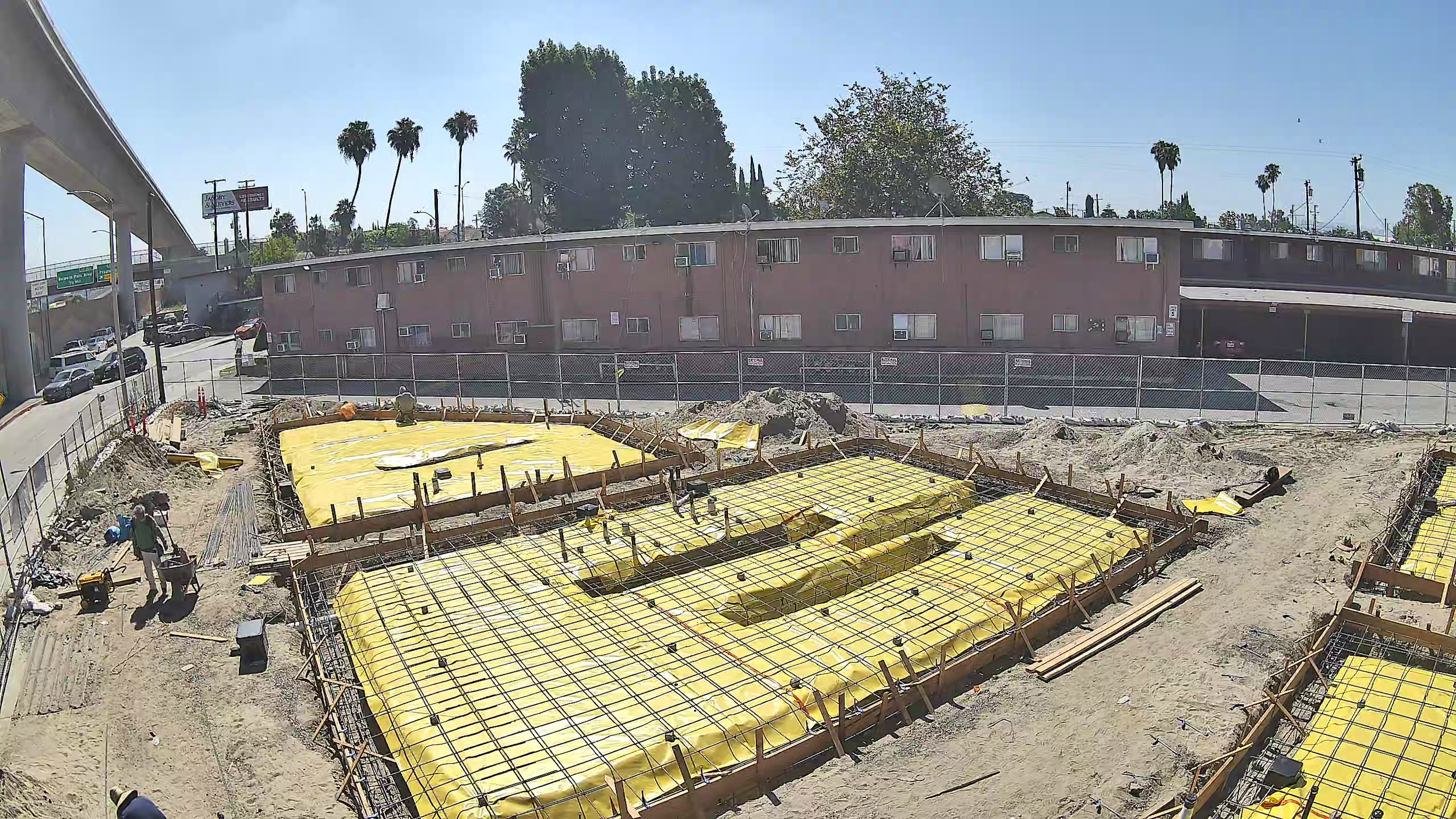 Foundation reinforcement installed over a yellow vapor barrier