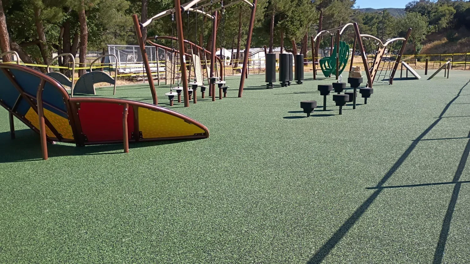 Installed LAUSD obstacle course with climbing features, stepping platforms and green surfacing