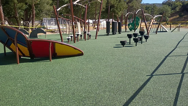Installed LAUSD obstacle course with climbing features, stepping platforms and green surfacing