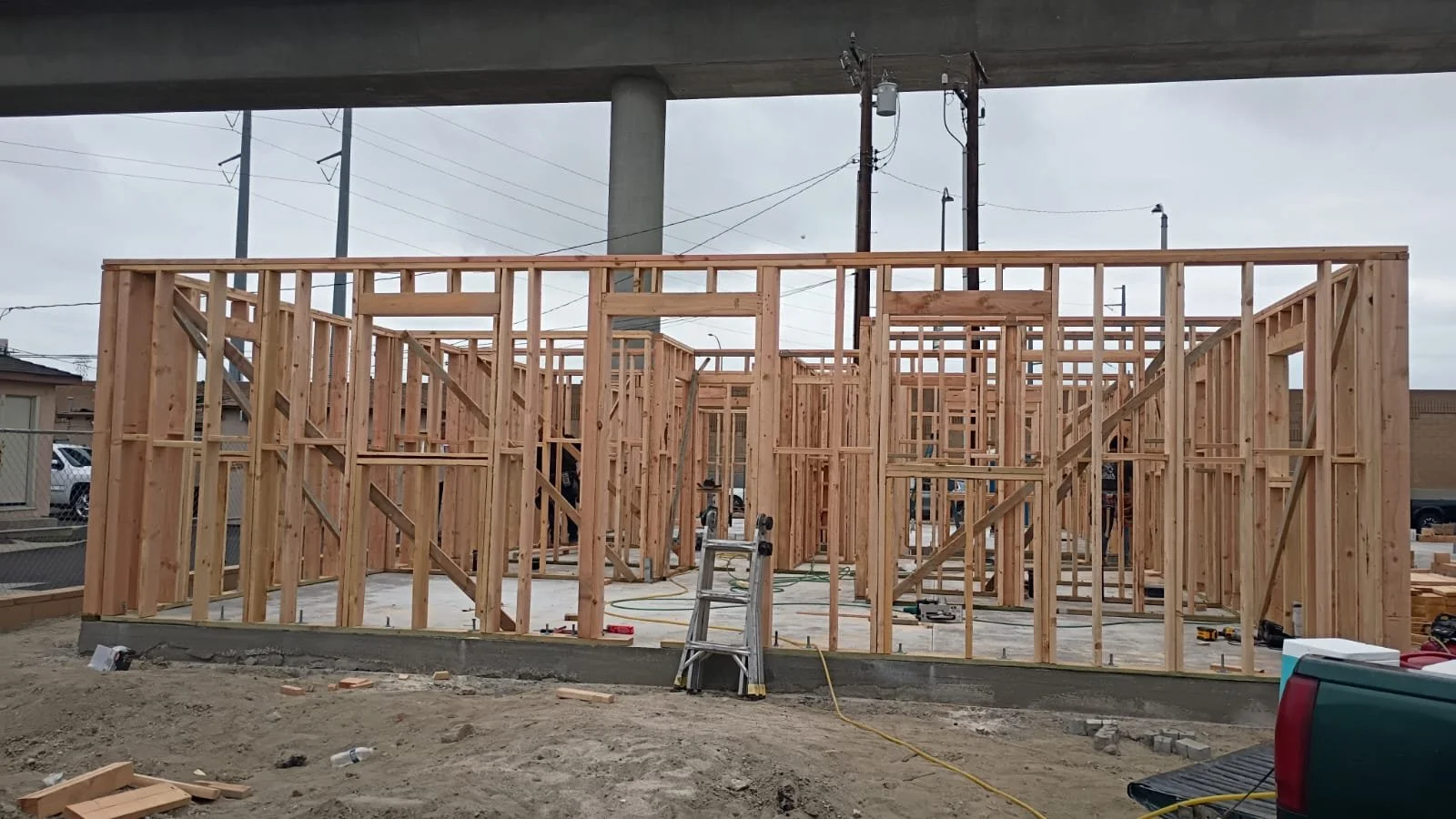 Wood wall framing on a concrete foundation slab