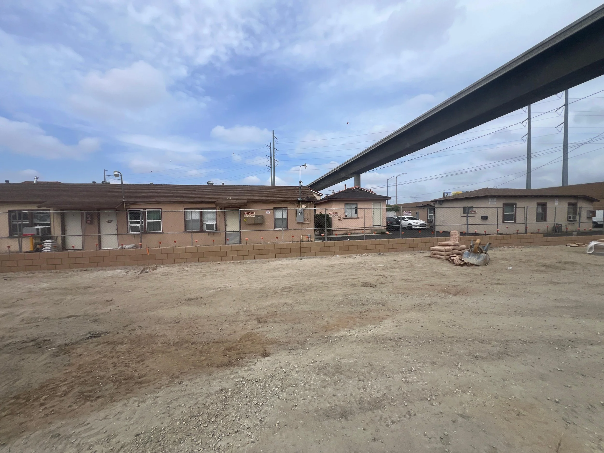 Prepared site with a new perimeter block wall