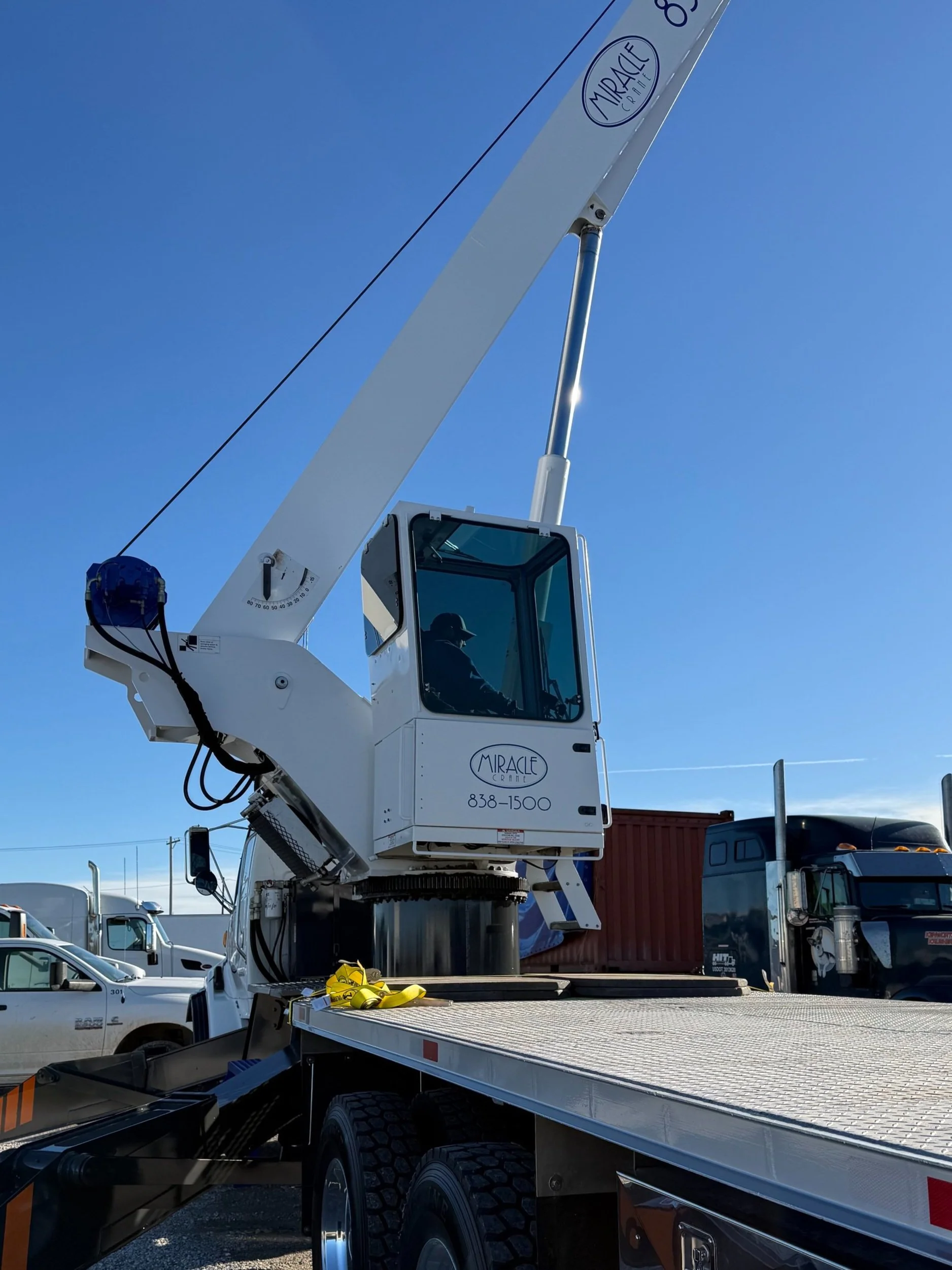 Miracle Crane operator in cab.