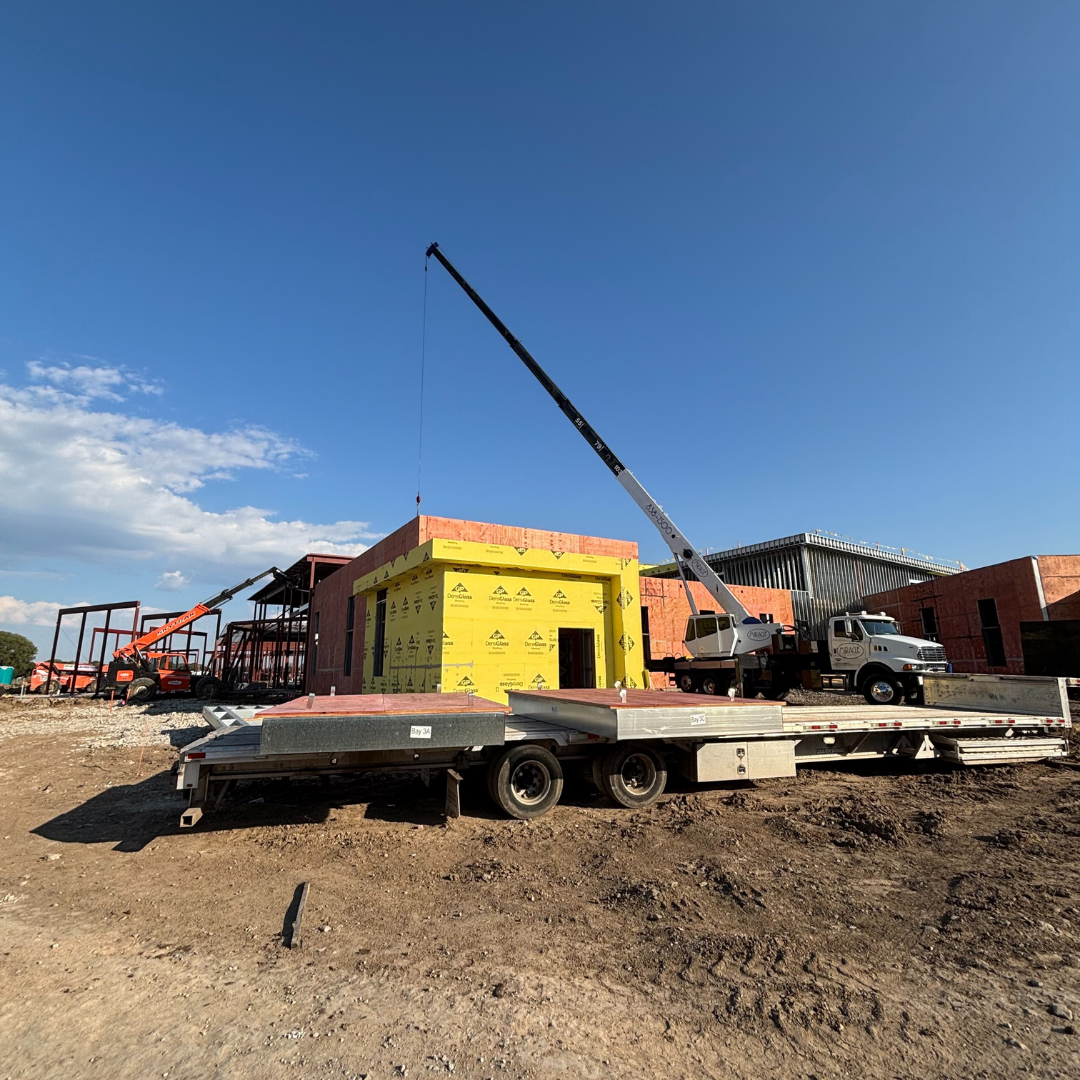 Miracle Crane helping a construction company on a job site.