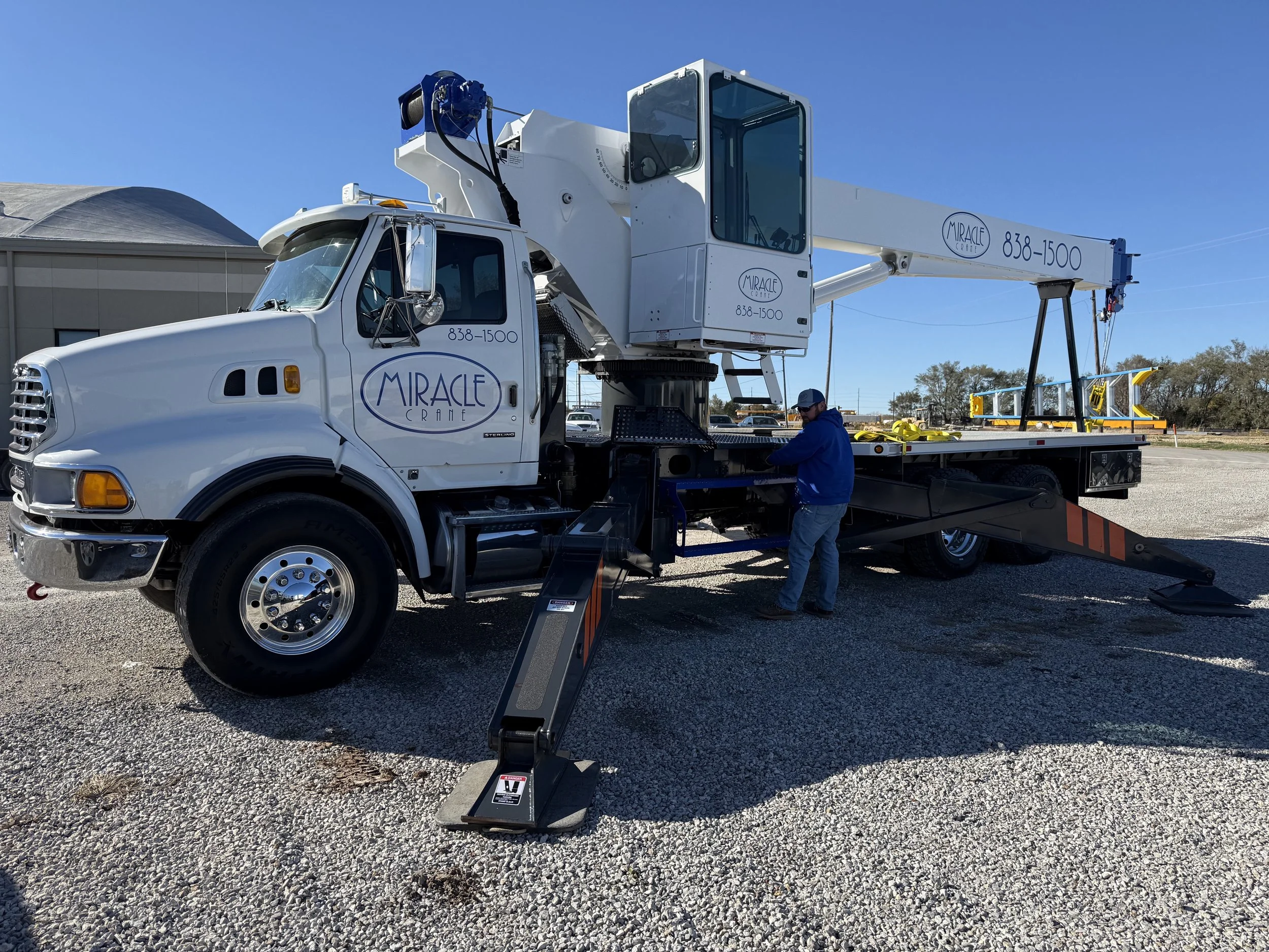 Crane operature prepping crane for lifting.
