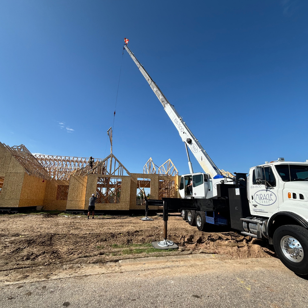 Miracle Crane lifting roof trusses for Wichita construction company.