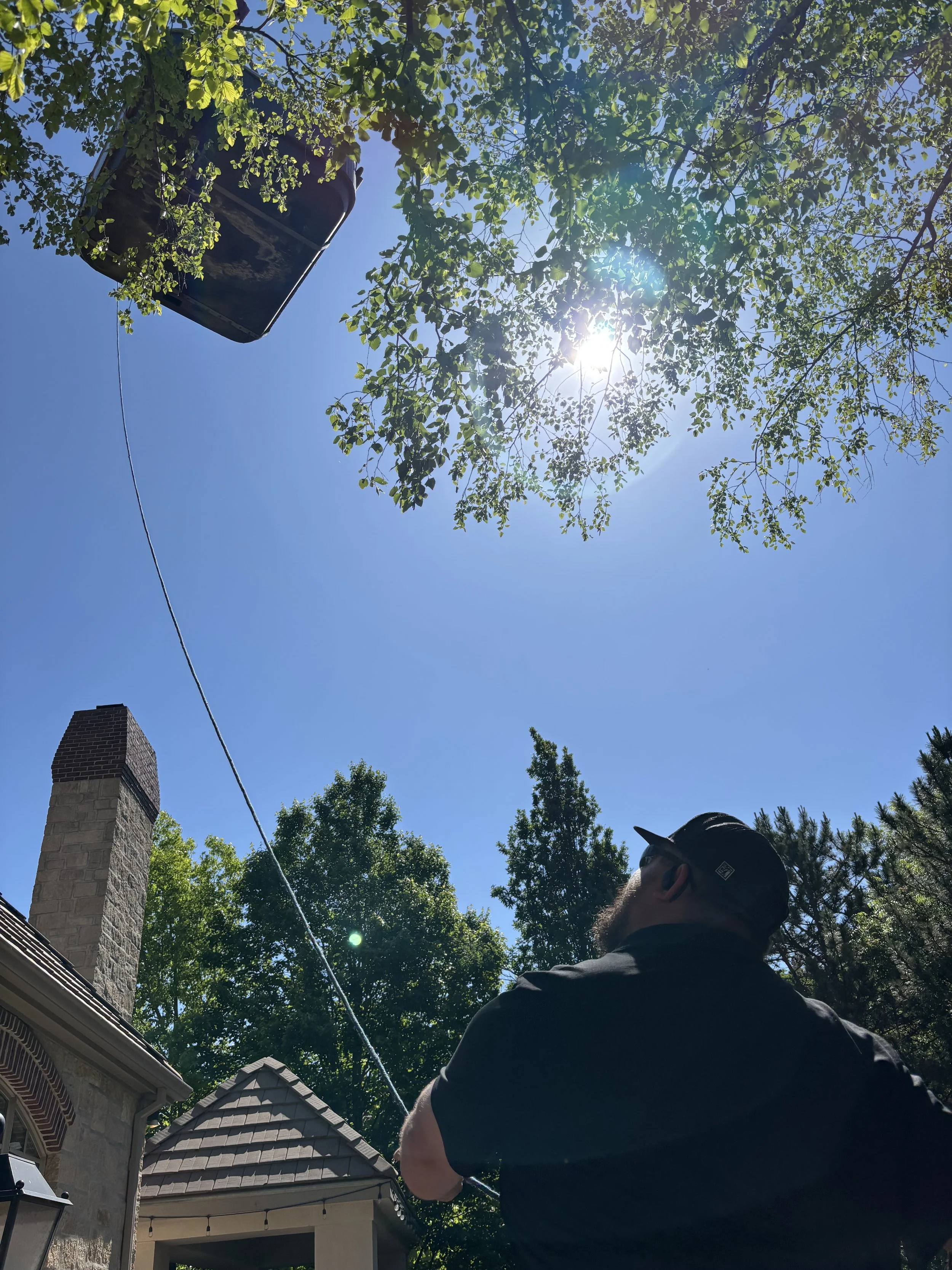 Miracle Crane lifting a Hot Tub over a house in the Flint Hills of Kansas.