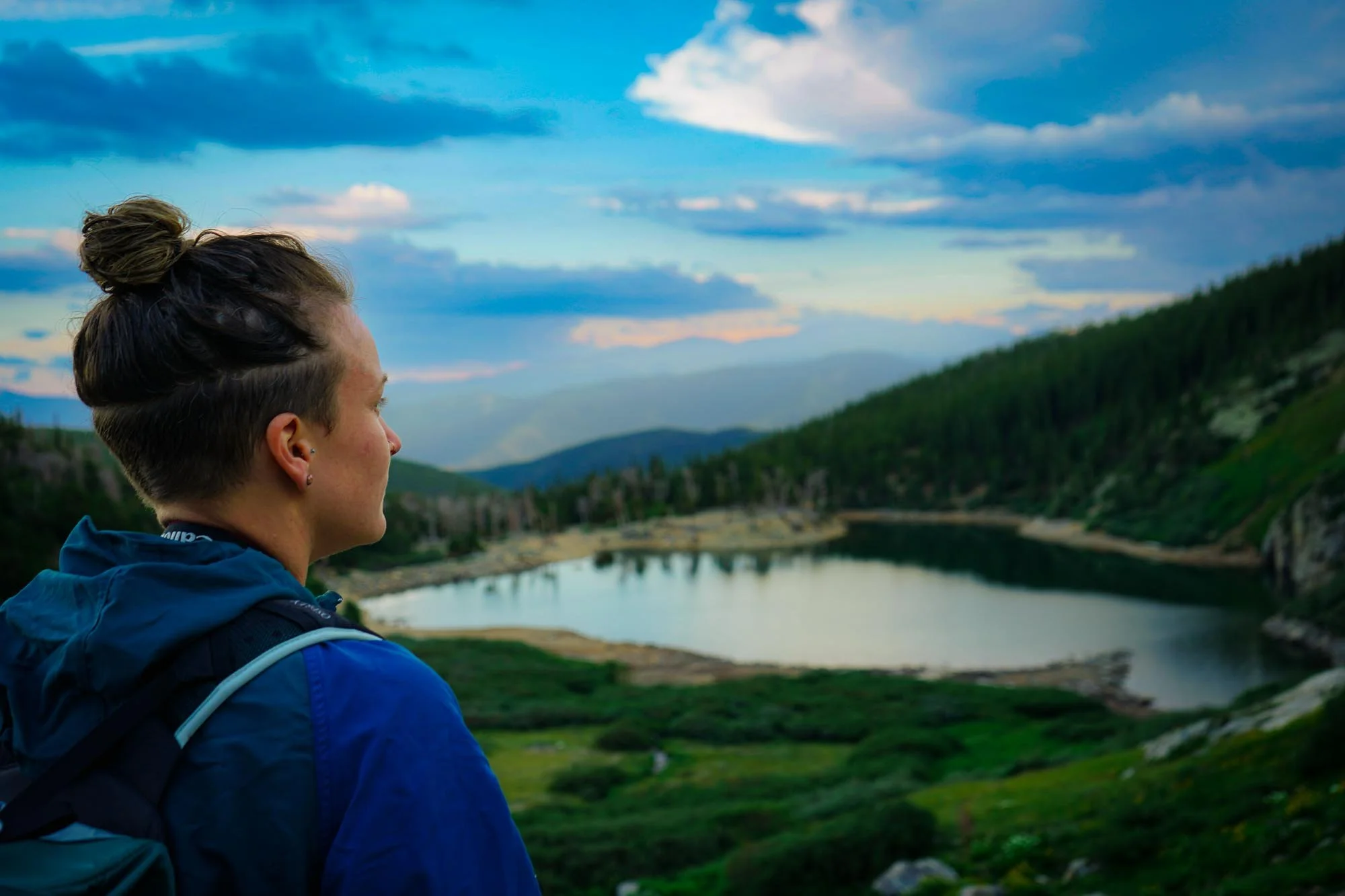 LGBTQ Photographer Kayley Olson looking out to St Mary's Glacier in Idaho Springs Colorado