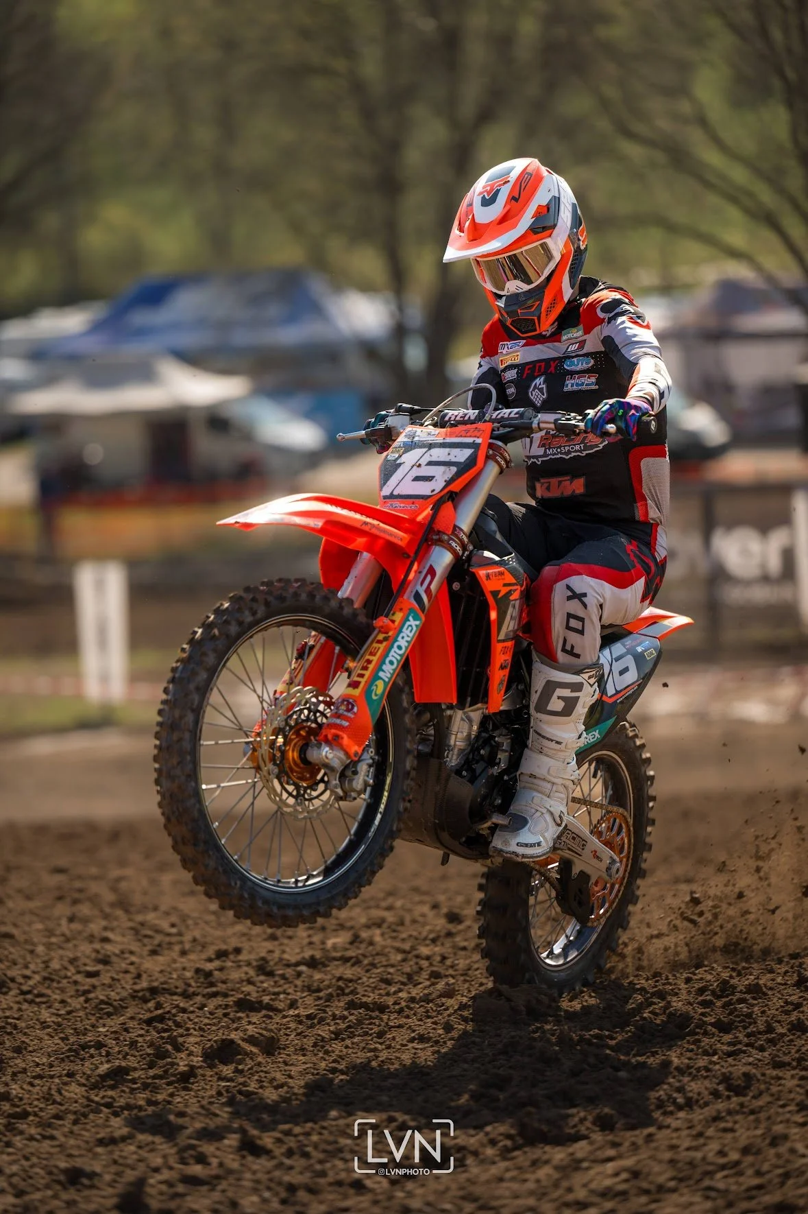 motocross rider wheelie on KTM bike during race