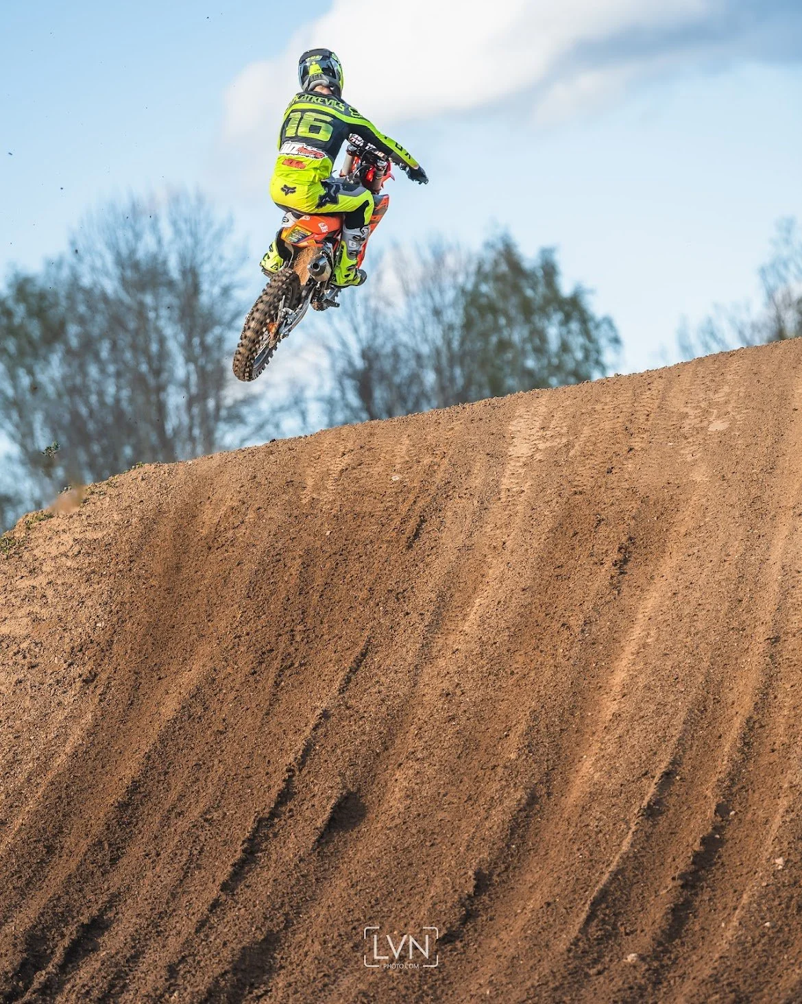 Motocross rider taking off for a big jump