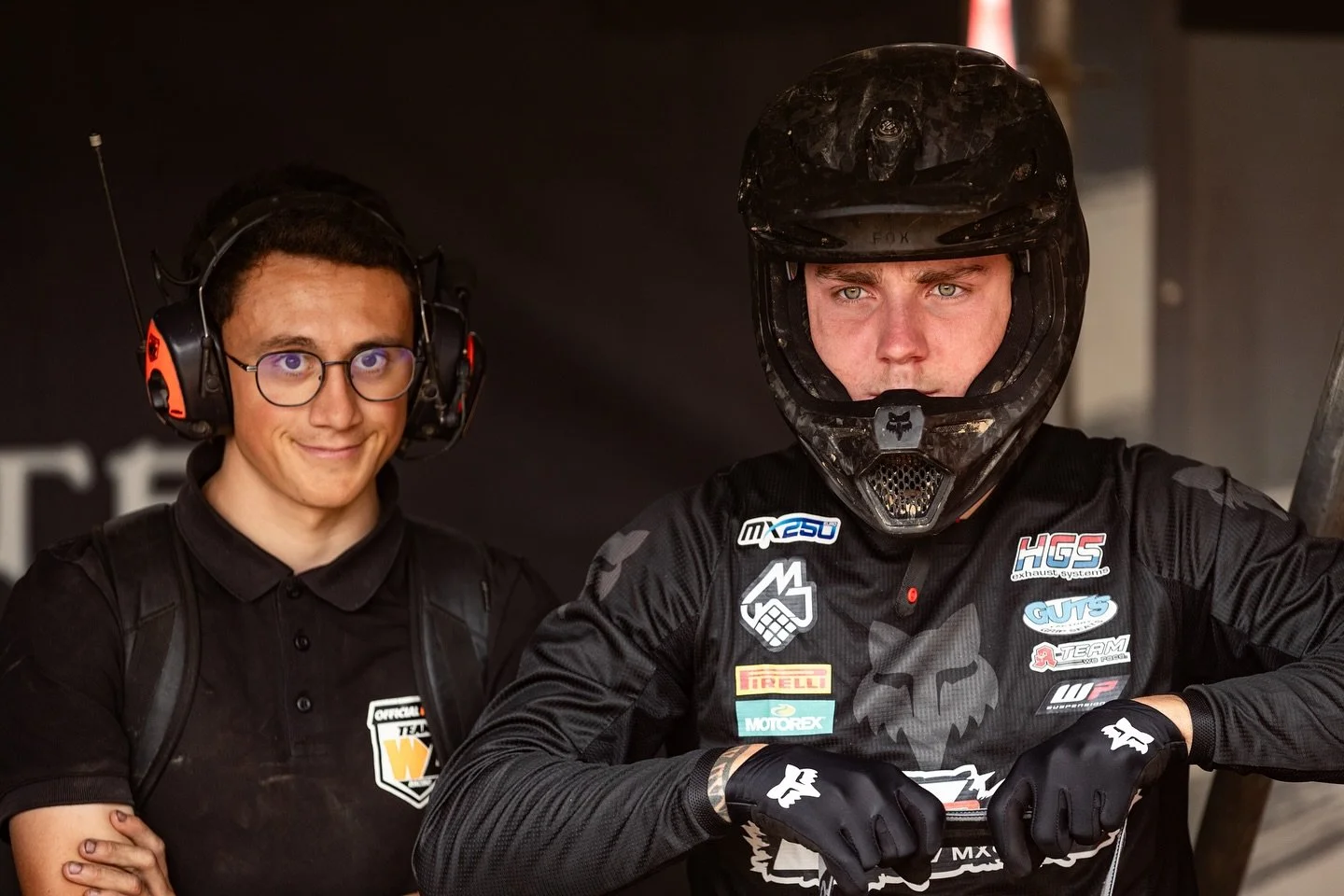 motocross team members in pit area