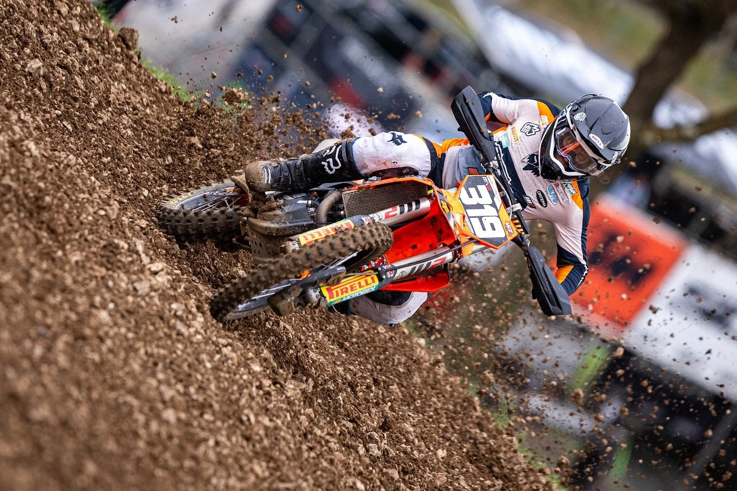 KTM motocross rider cornering on dirt track