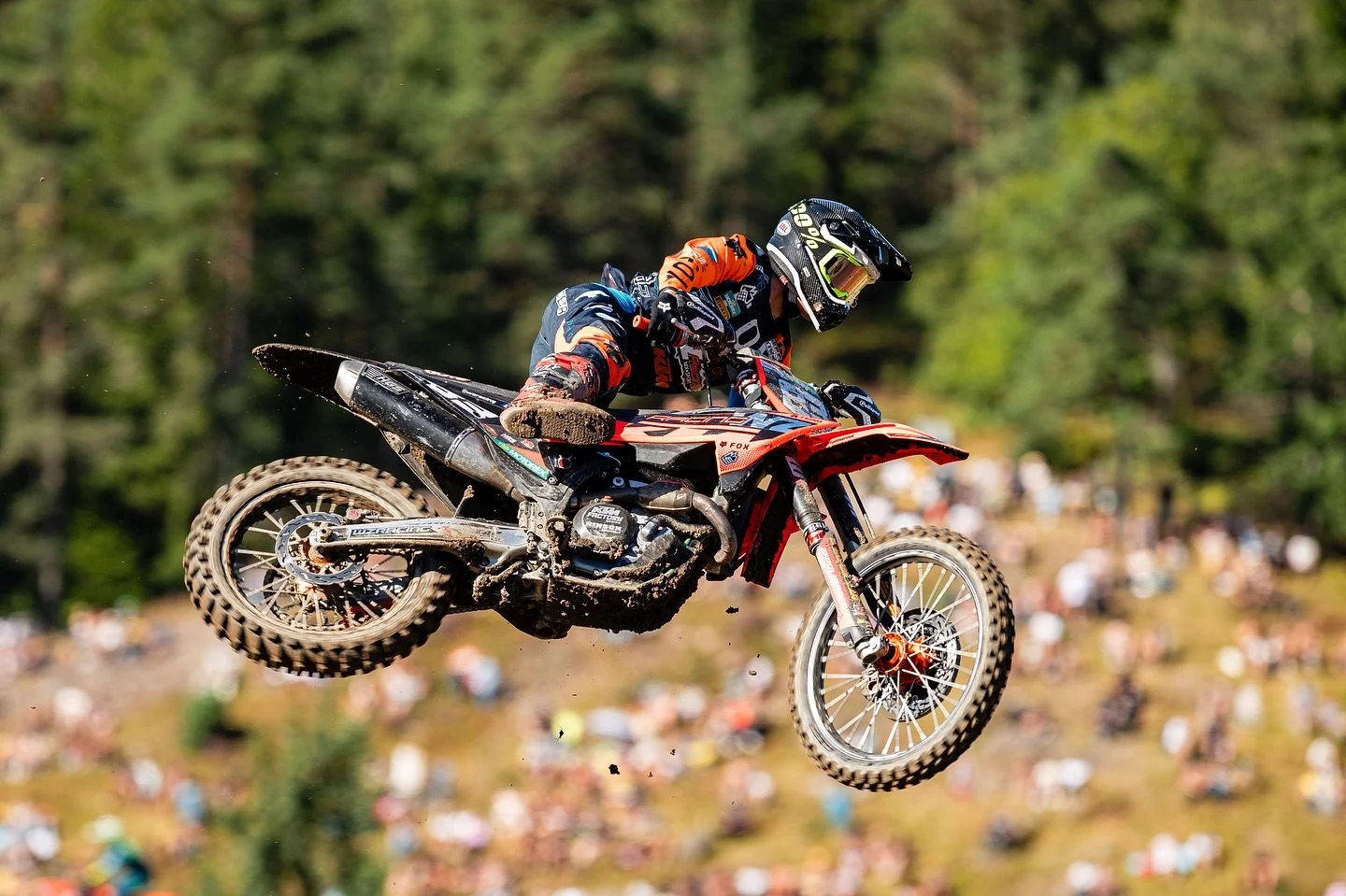 motocross rider performing jump during race