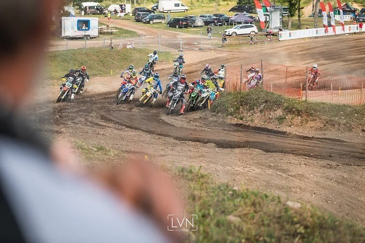 motocross race start with multiple riders on dirt track