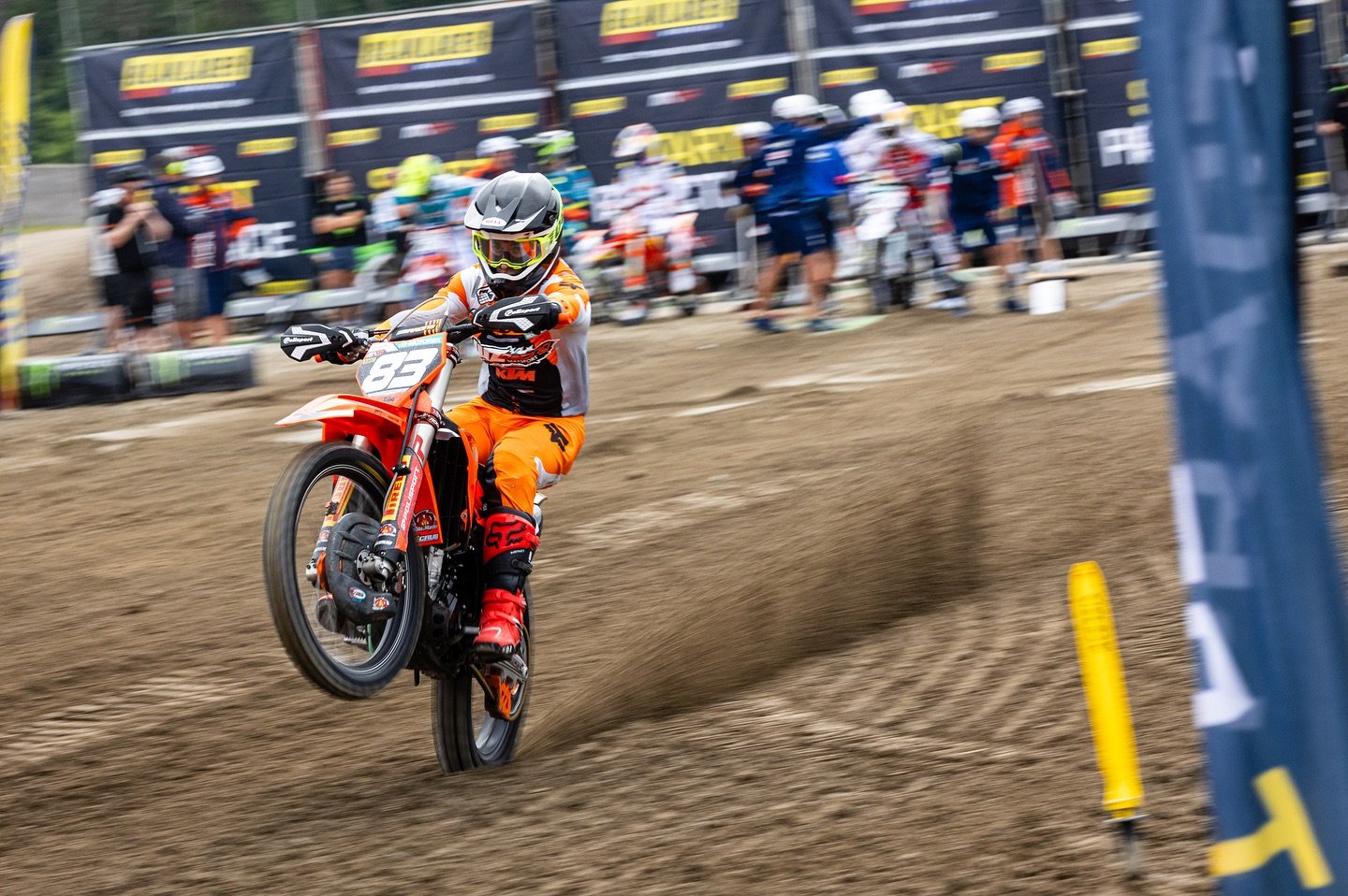 motocross rider wheelie on the start straight