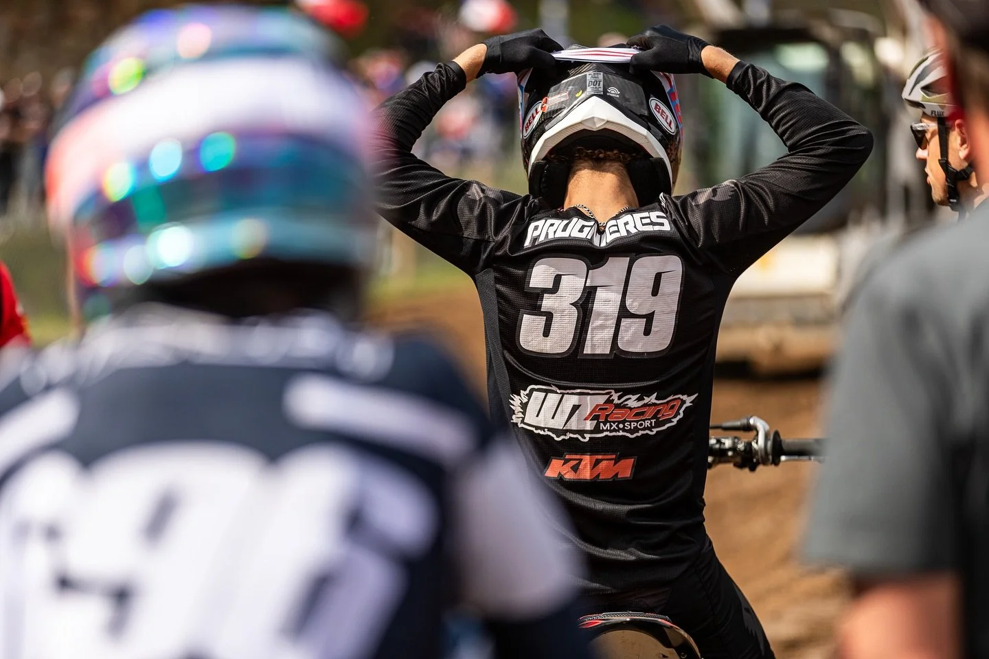 motocross rider number 319 preparing for race