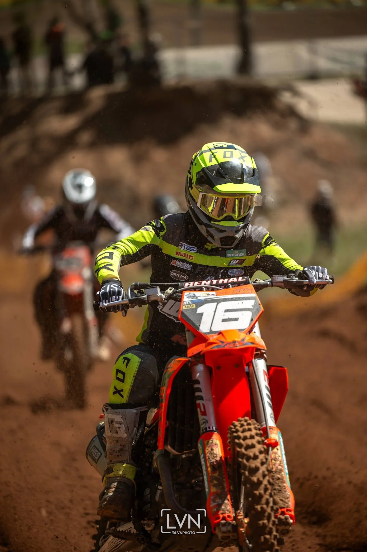 motocross rider number 16 riding on dirt track