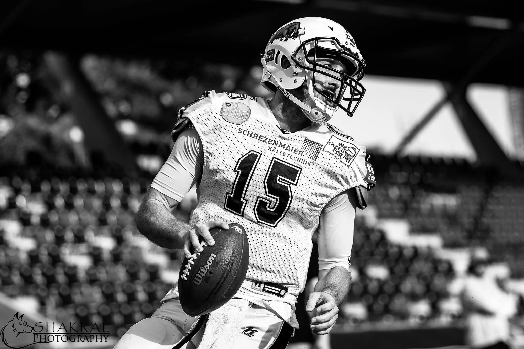 quarterback holding a football during competitive play, highlighting elite quarterback training, game preparation, and performance development