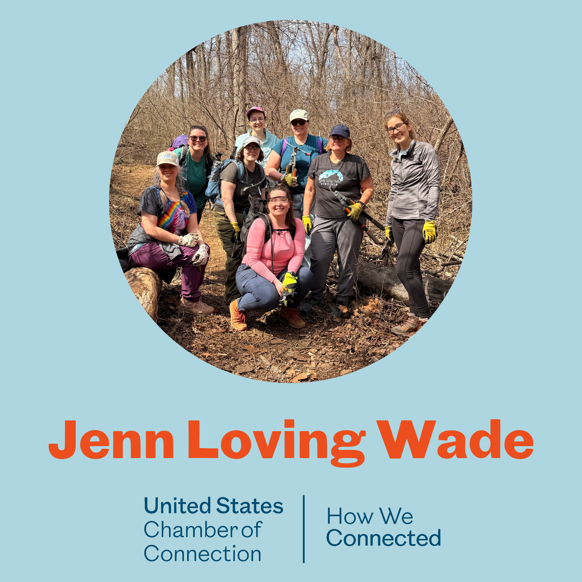 Group of women hiking in a wooded trail on a sunny day, with trees and branches in the background.
