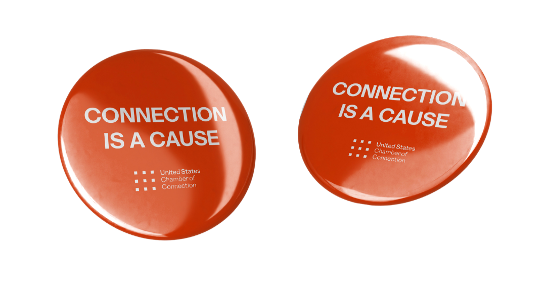 Two red circular (or button-like) objects with the phrase "CONNECTION IS A CAUSE" and the logo of the United States Chamber of Commerce.
