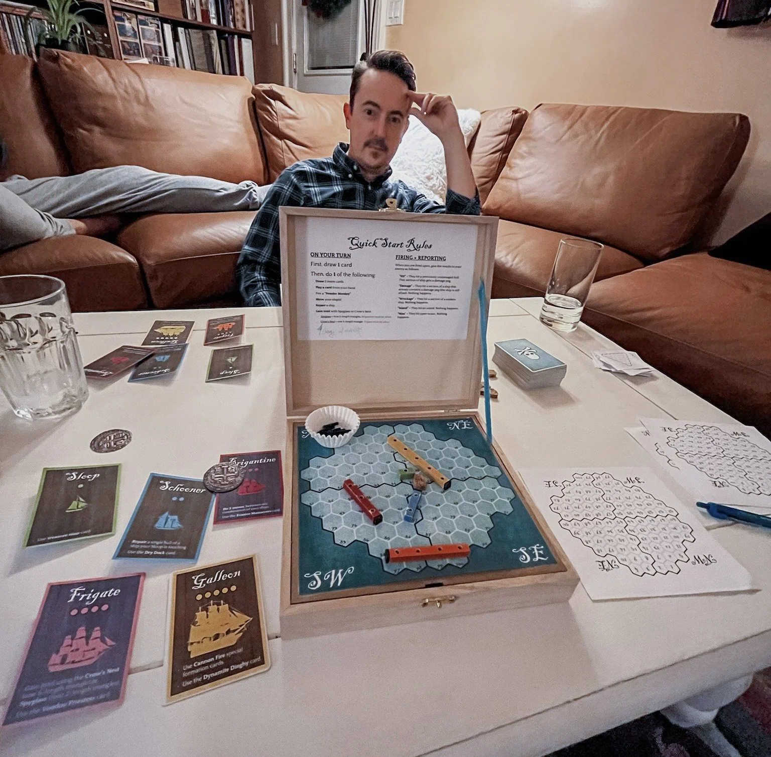 December 2022. The next iteration of our prototype featured a colored grid, handmade wooden ships, and printed cards.