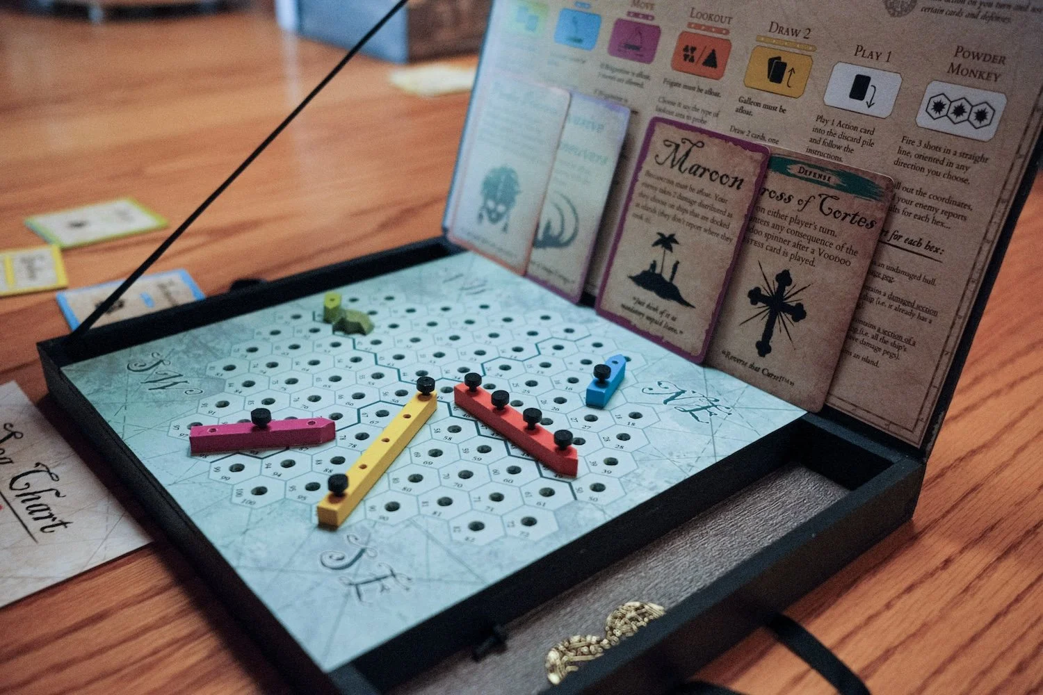 A wooden box and board game set, showcasing a beautifully crafted wooden game board ready for play.