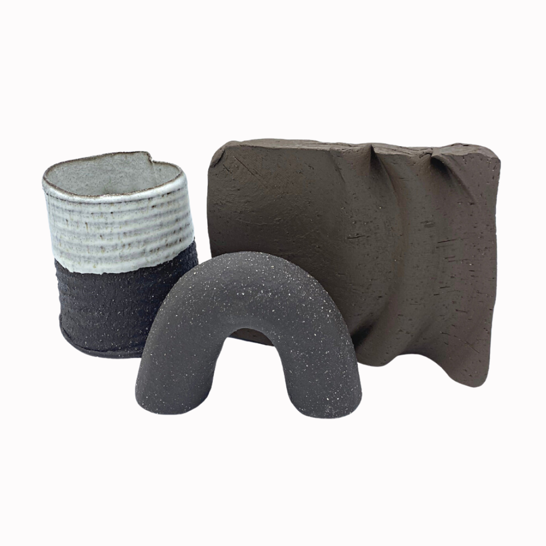 fired piece showing the charcoal black clay body with white flecks