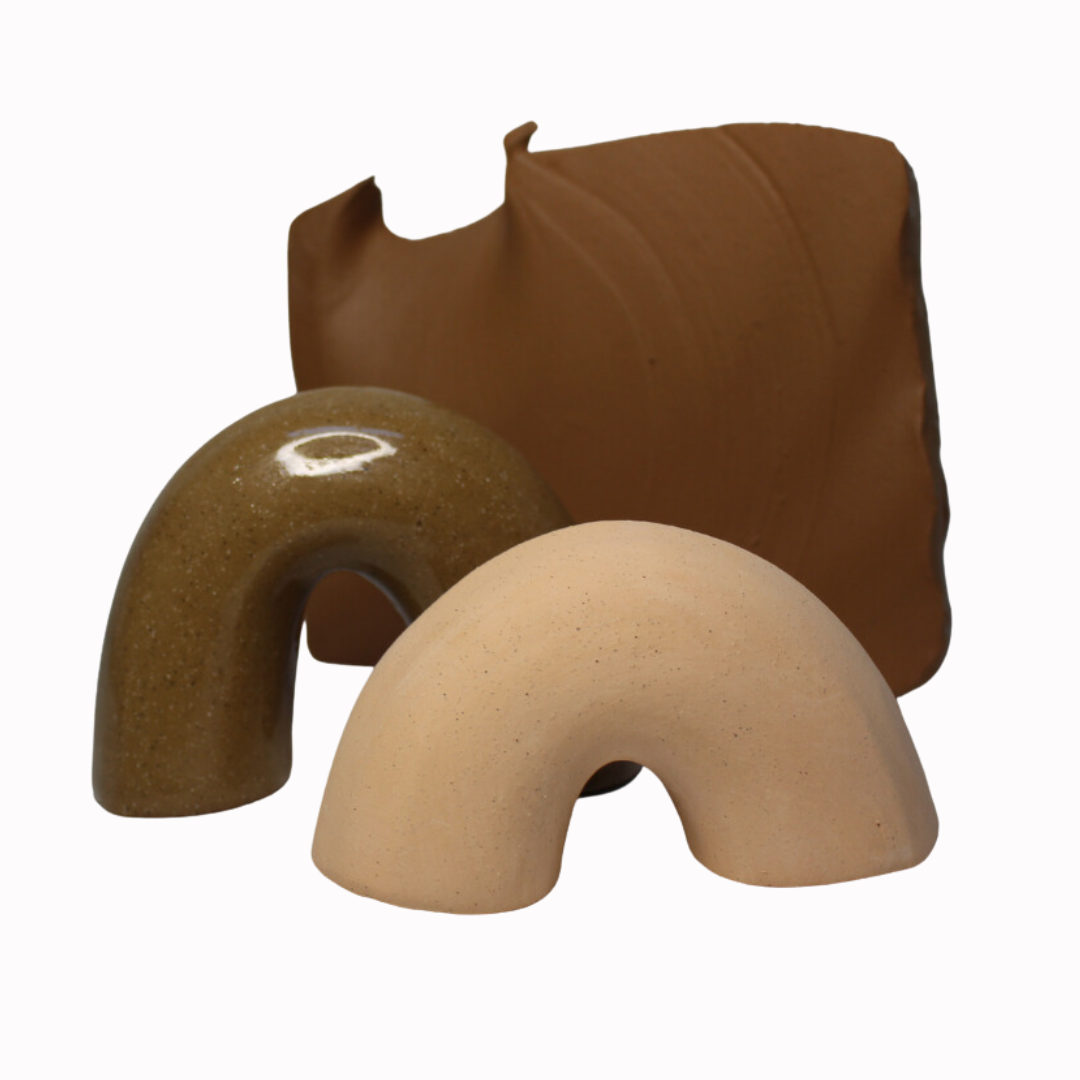 fired piece showing the warm tone of the clay. the image highlights the colour difference between a clear glazed and unglazed piece, with the colour deepening when glazed.