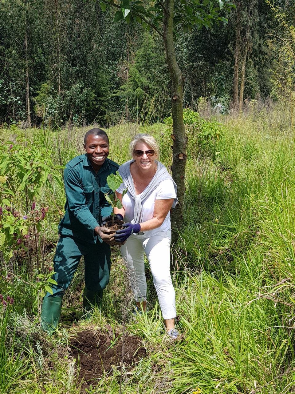 Debbbie planting a tree at Bisate.jpeg
