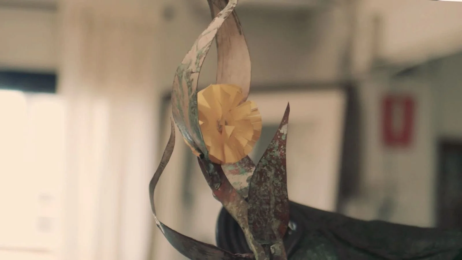 A hand-forged metal sculpture of a flower, from the Bent Metal Foundry film