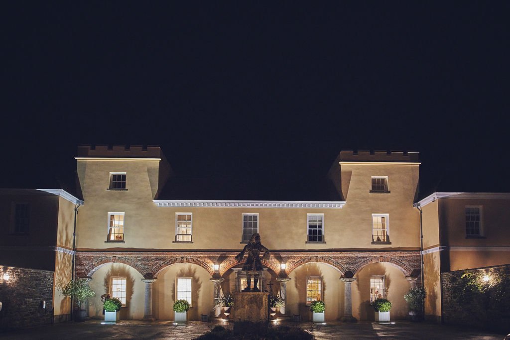 Pentillie Castle at night time with the lights on. Photographed by Nova Photography..
