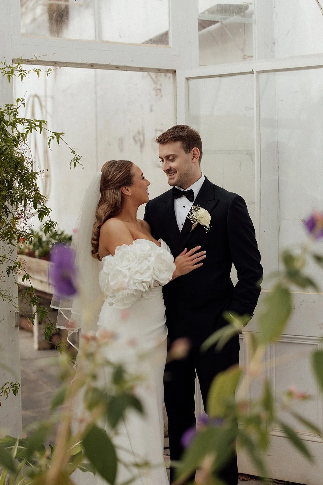 Bride and groom in the kitchen gardens at Pentillie Castle. Photographed by Katie Goff.