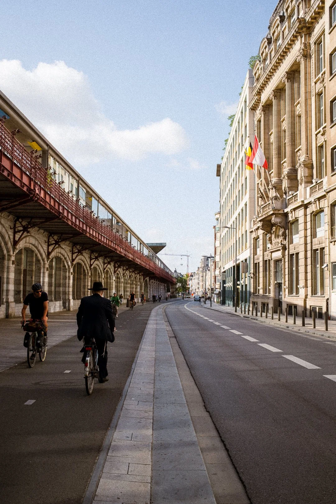 A Jewish man cycling along the Central Station in Antwerp.