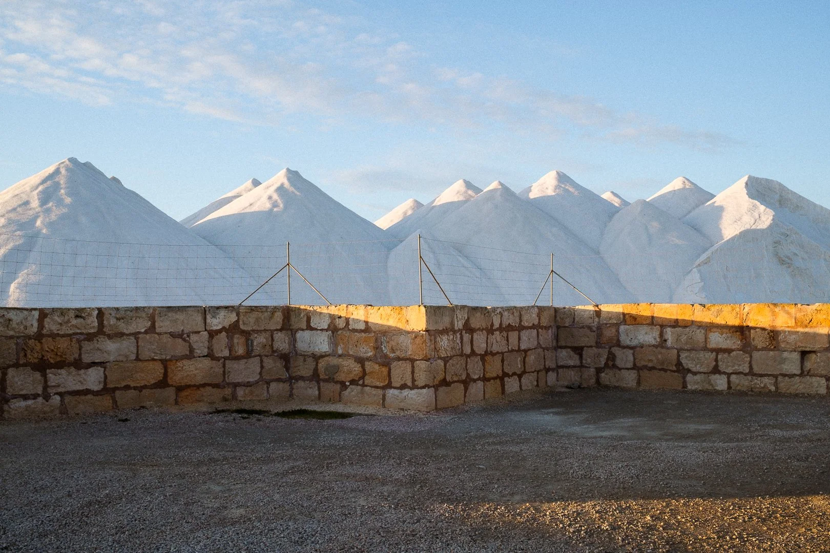 Salt piles in the setting sun