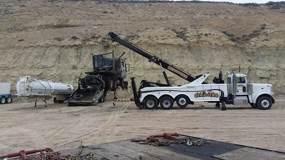 Stauffer's tow truck handling a vehicle towing job