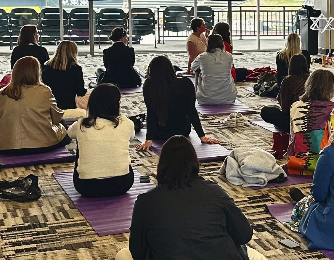 Participants in a guided meditation session at a Sumac Arts mindfulness workshop in South Carolina