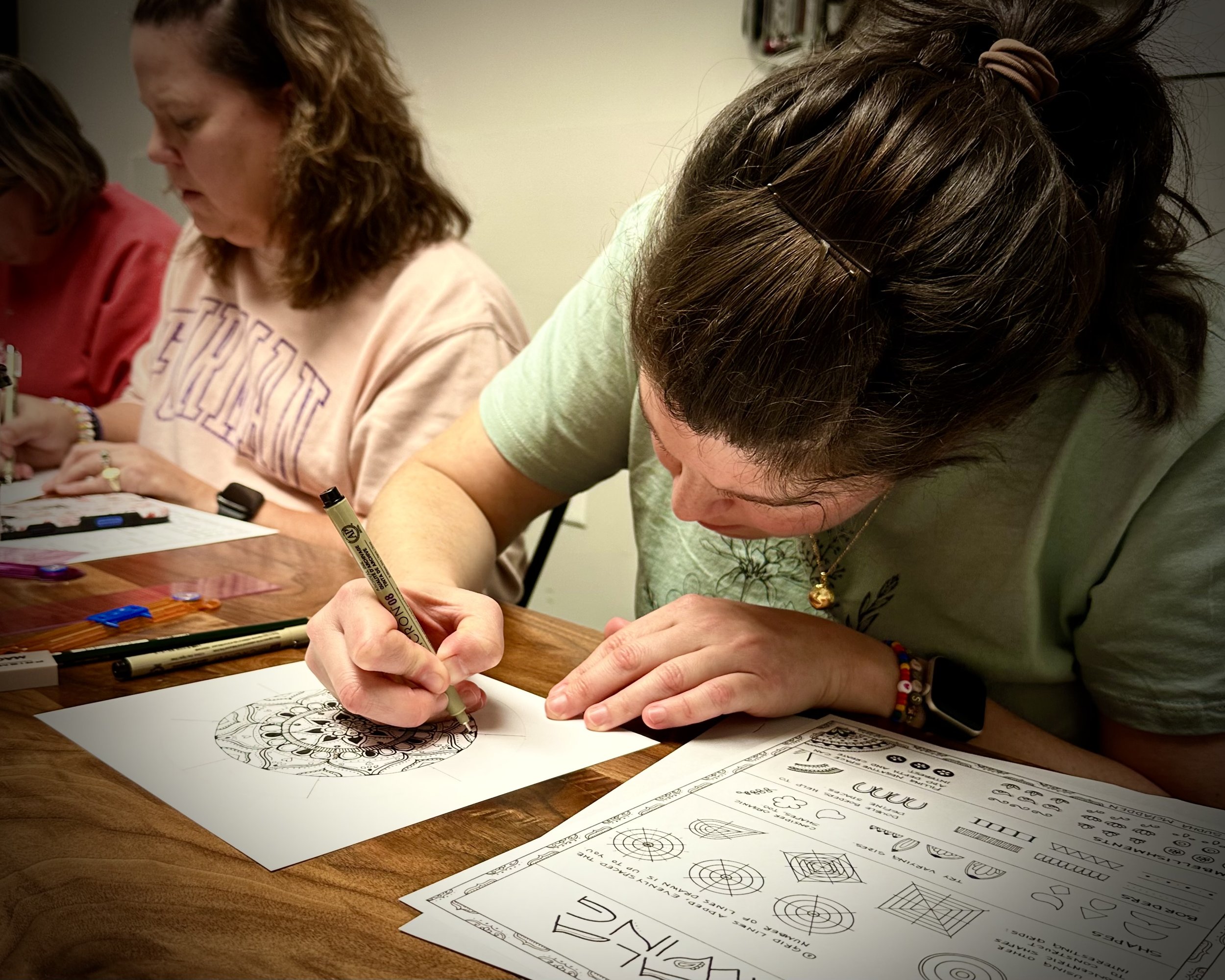 Participant drawing a mandala at a Sumac Arts resilience workshop in South Carolina