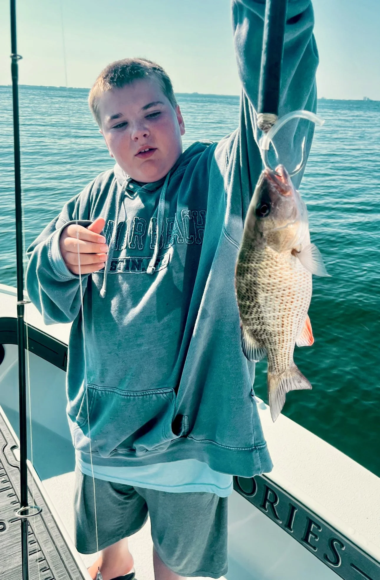 DJ holding his first fish