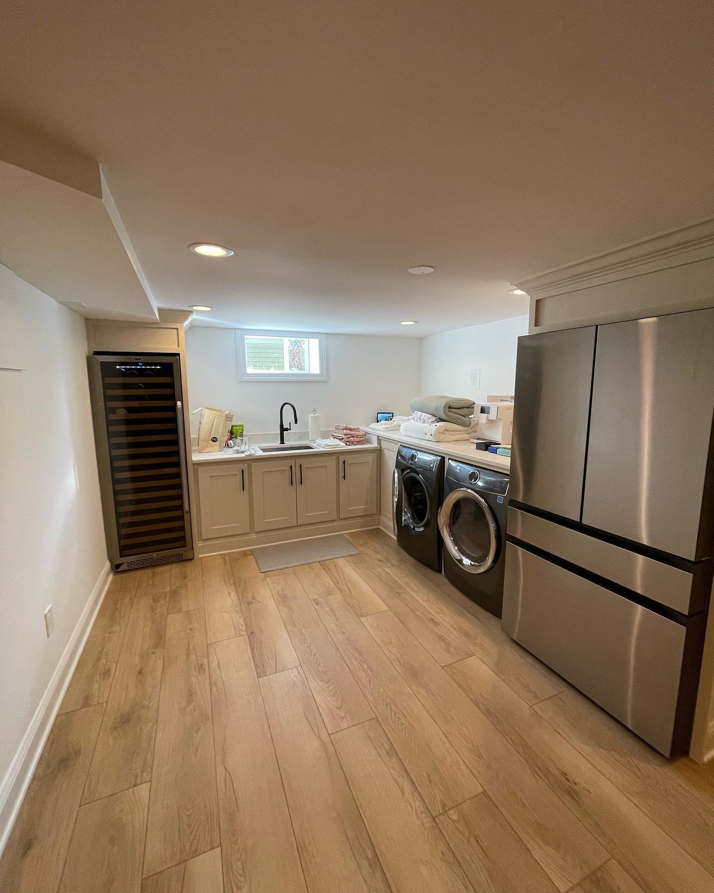 Just incase anyone was wondering we&rsquo;re still in business I just prioritize doing the work not posting it🤗 however I will try to do better. Here&rsquo;s a classic basement finish featuring an elegant laundry station with easy access wine for th