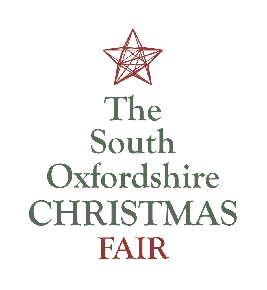 Poster for The South Oxfordshire Christmas Fair with a red geometric star at the top and green and red text