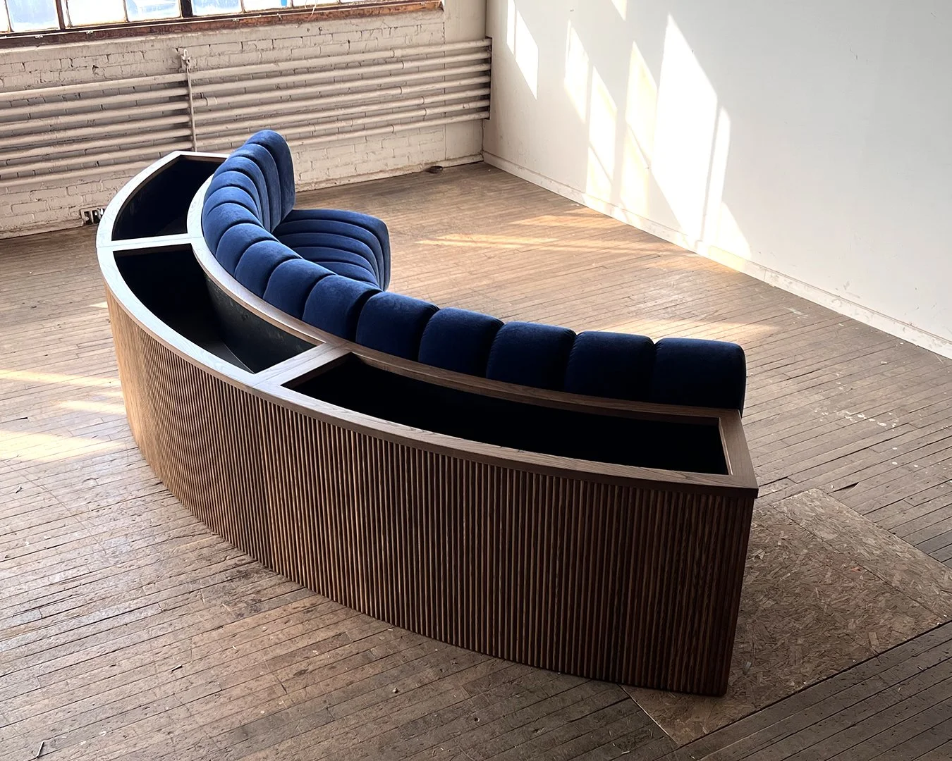 Custom Curved Banquette with Built-in Planter Box