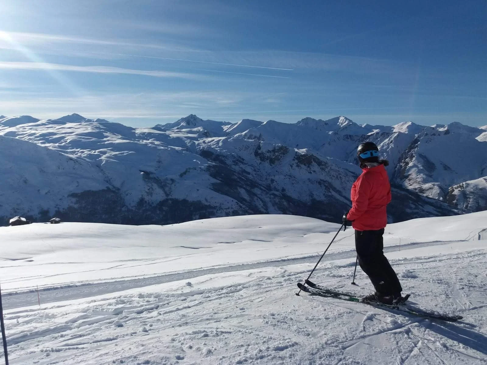 Kate Casali, The Ski Mindset Coach, looking across the mountains before skiing, reflecting on confidence and mindset.