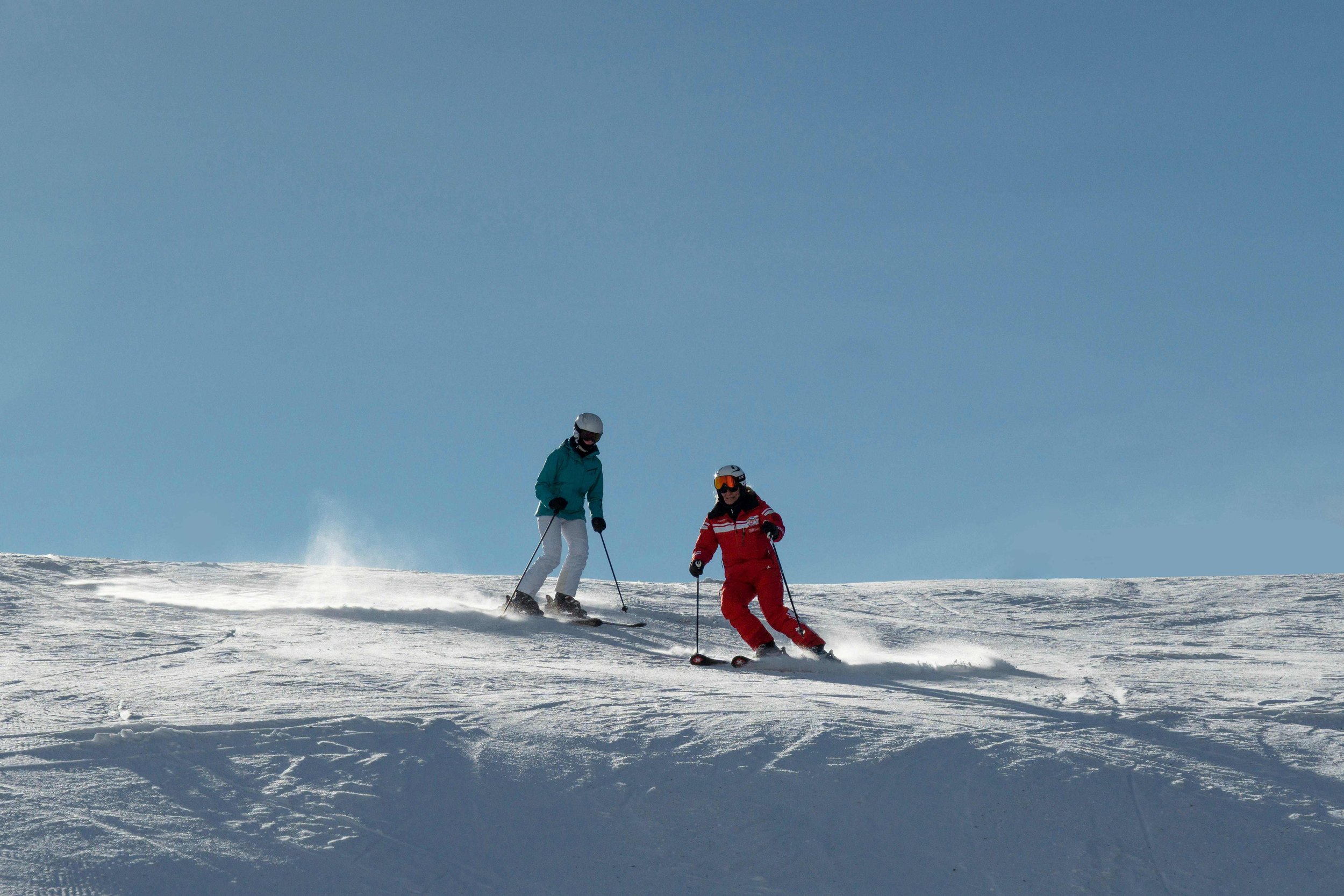Female Ski Instructor with female client following.jpg
