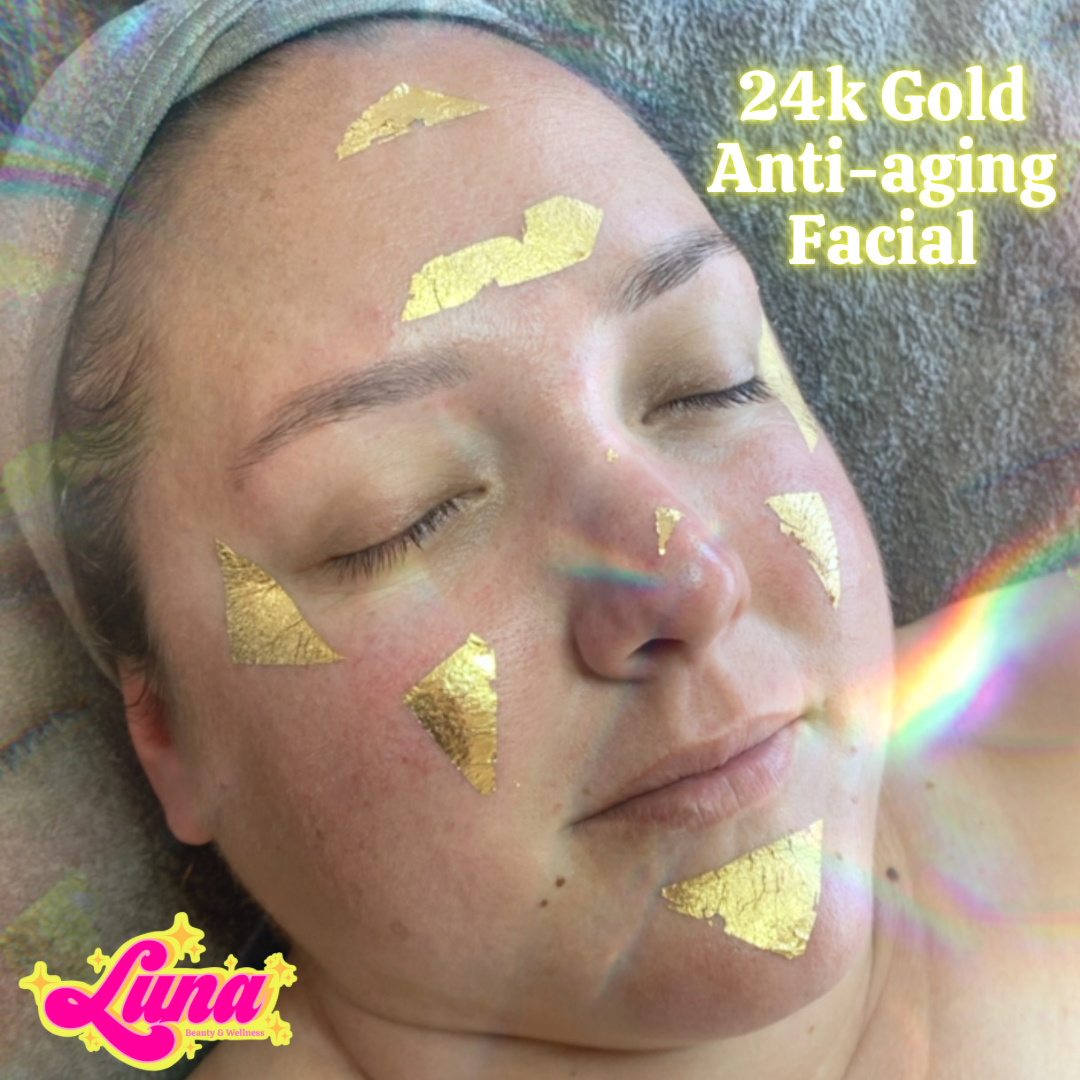 Close-up of a woman with gold facial patches on her face, lying down with eyes closed, advertising 24k gold anti-aging facial by Luna Beauty & Wellness.