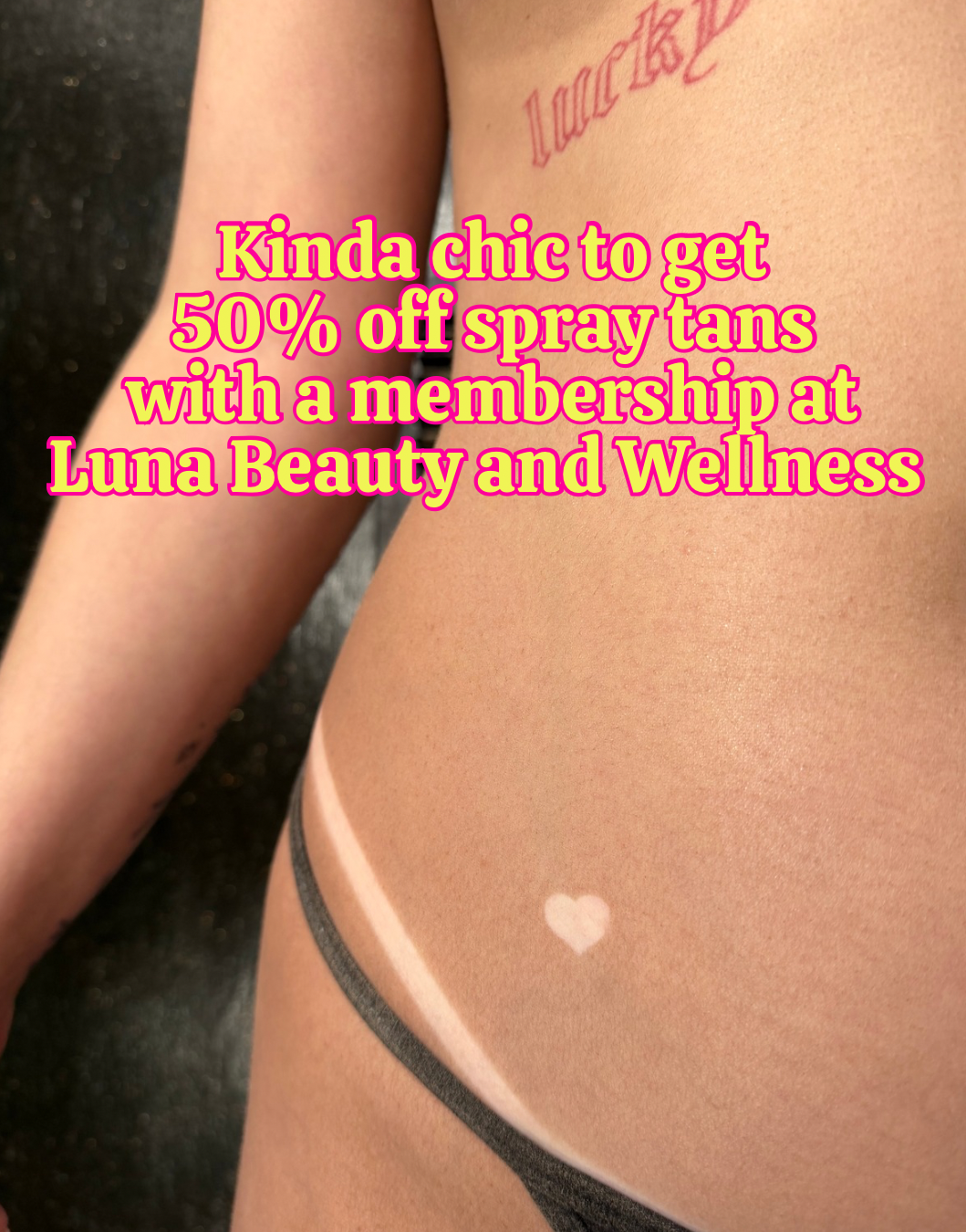 Beautiful medium brown spray tan at Luna Beauty and Wellness in Camarillo. Heart and bikini tan line on hip.