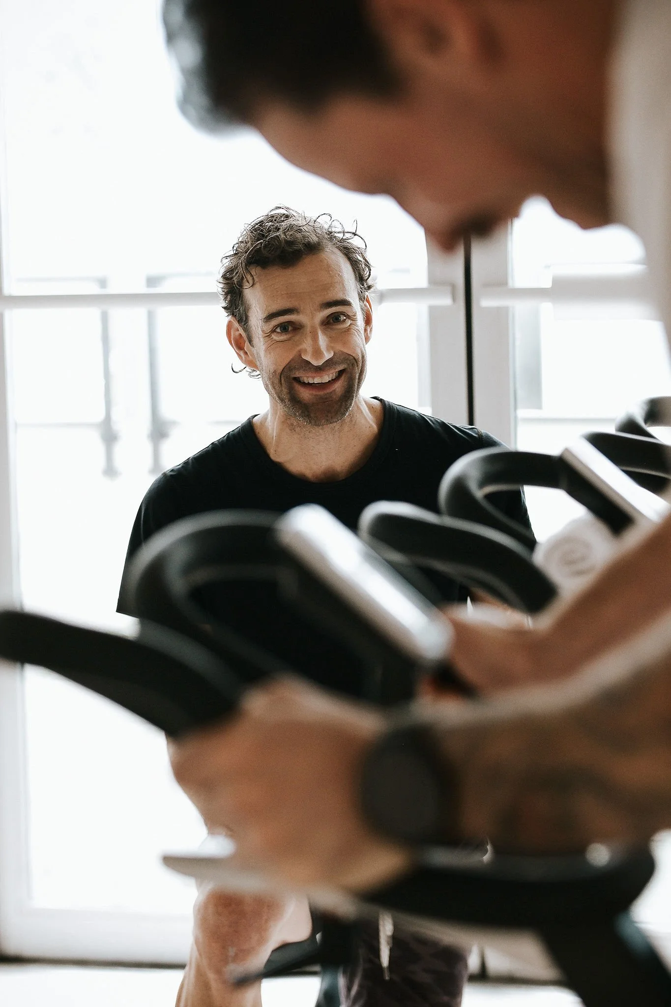 A guided indoor cycling class in downtown Vancouver.