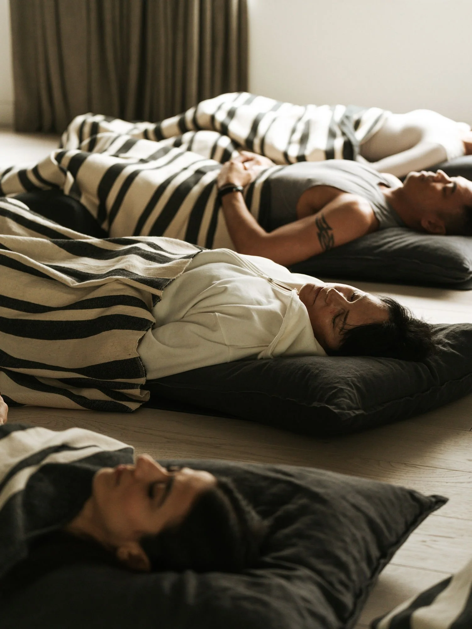 Participant relaxing after a breathwork healing session in Vancouver at Ritual Urban Retreat, feeling grounded and renewed.