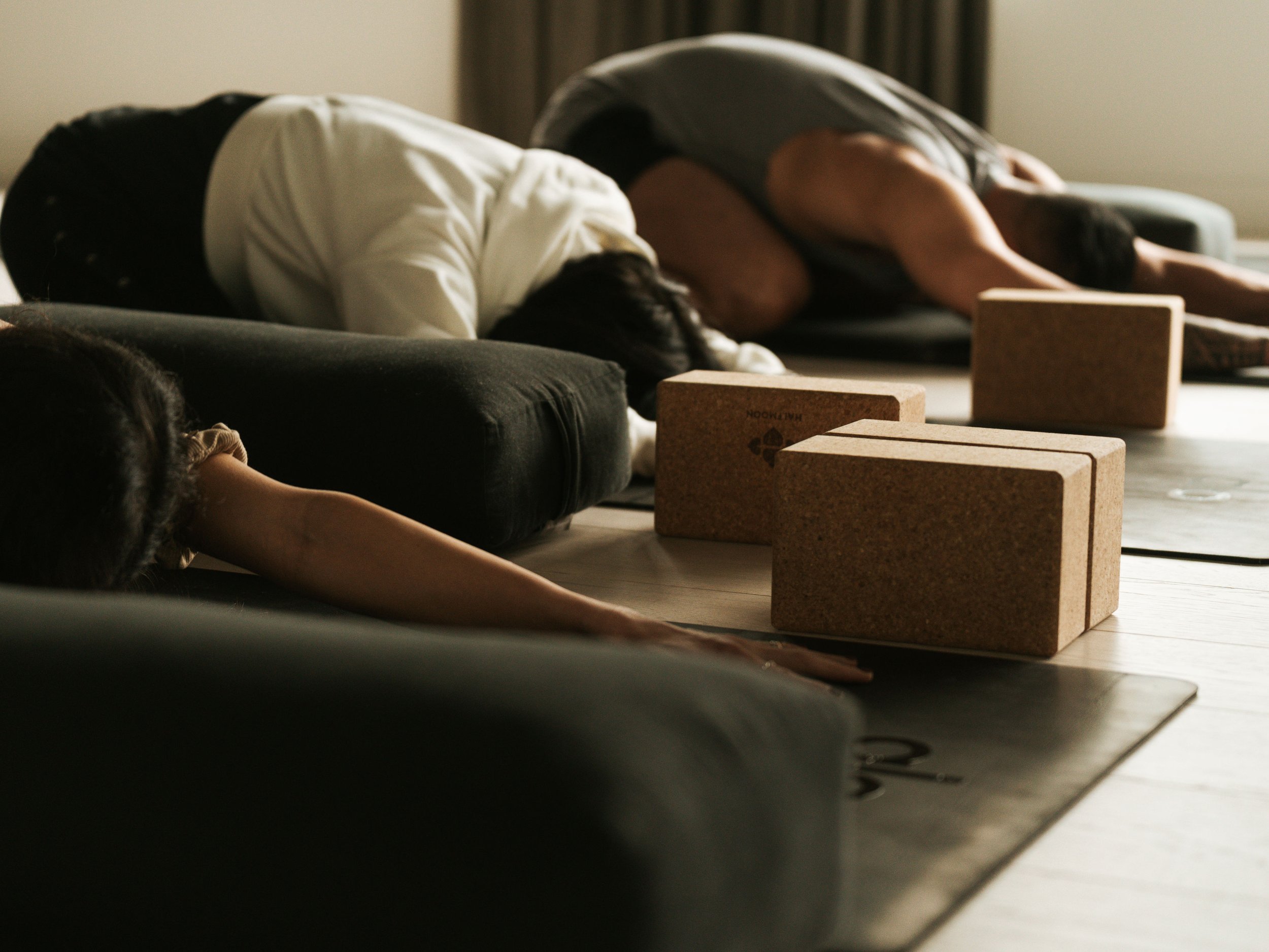 Relaxing yoga class at Ritual Urban Retreat, a leading yoga studio in Vancouver focused on strength, balance, and wellness.