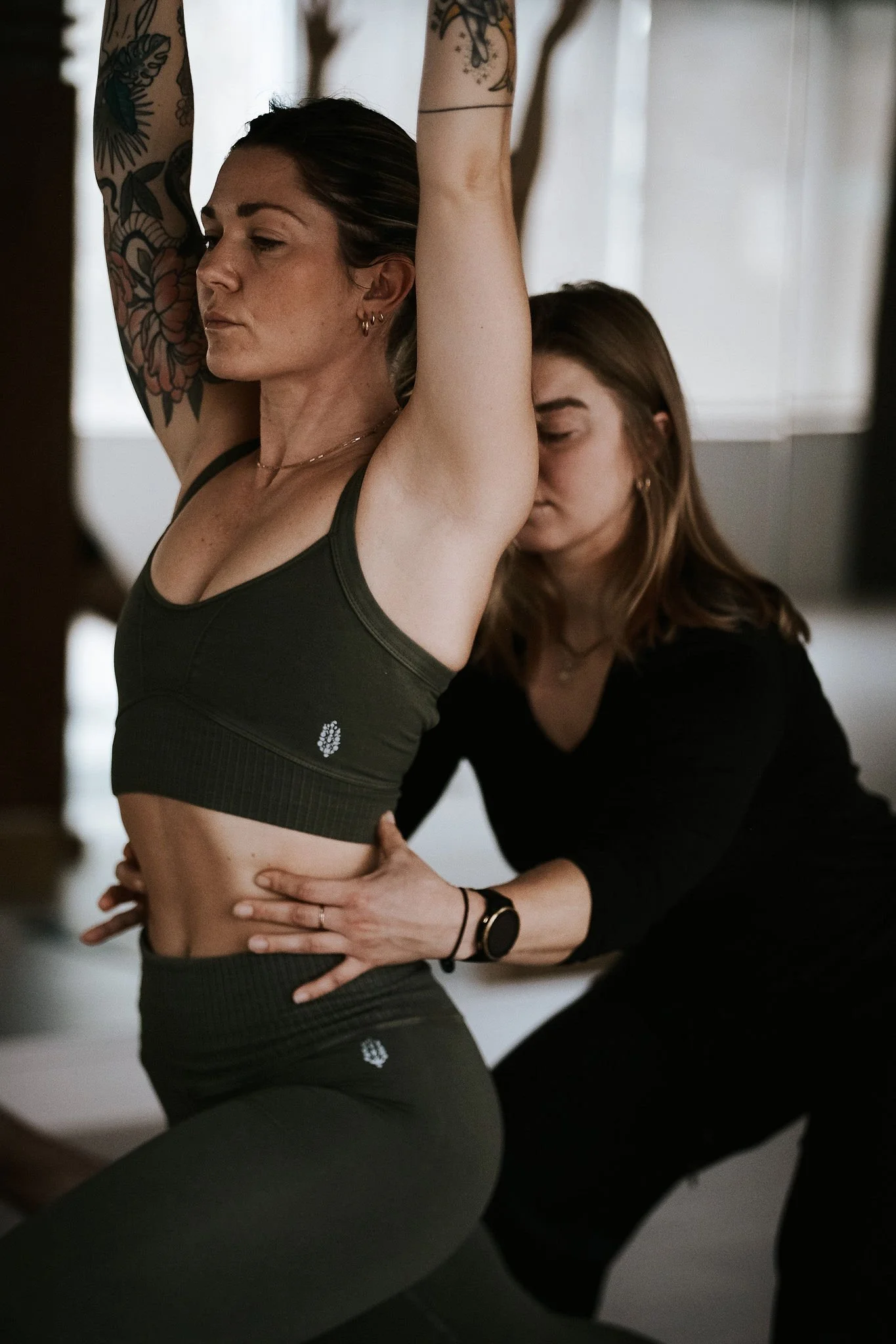 Yoga practitioner moving through a smooth yoga flow sequence at Ritual Urban Retreat in Vancouver